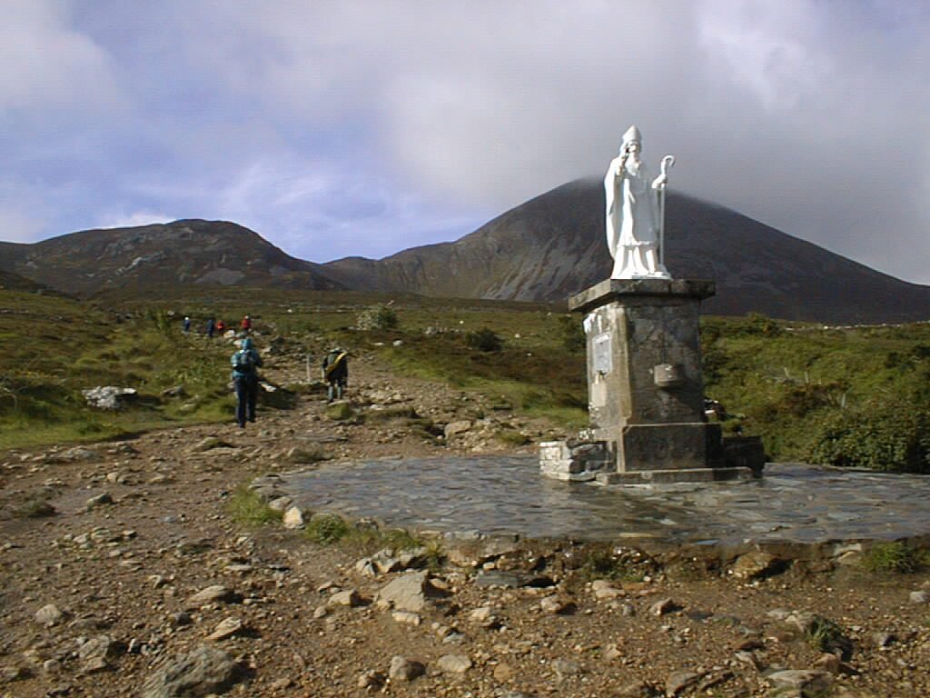 Croagh Patrick is behind the statue