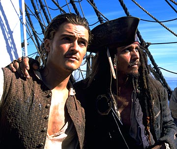 Orlando Bloom (left) as Will Turner and Johnny Depp (right) as Captain Jack Sparrow in Pirates of the Caribbean (2003).