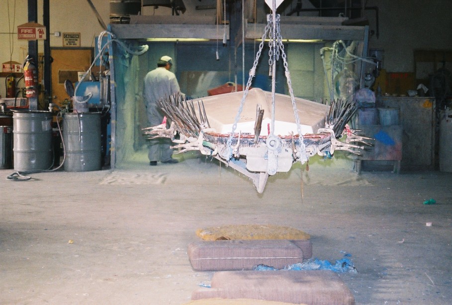 Clamps hold hull and deck pieces together while the pieces bond.