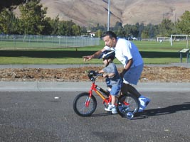 We got the bike too soon. He really began riding at age 4.