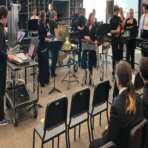 Percussion players in a band room