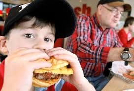 boy eating burger