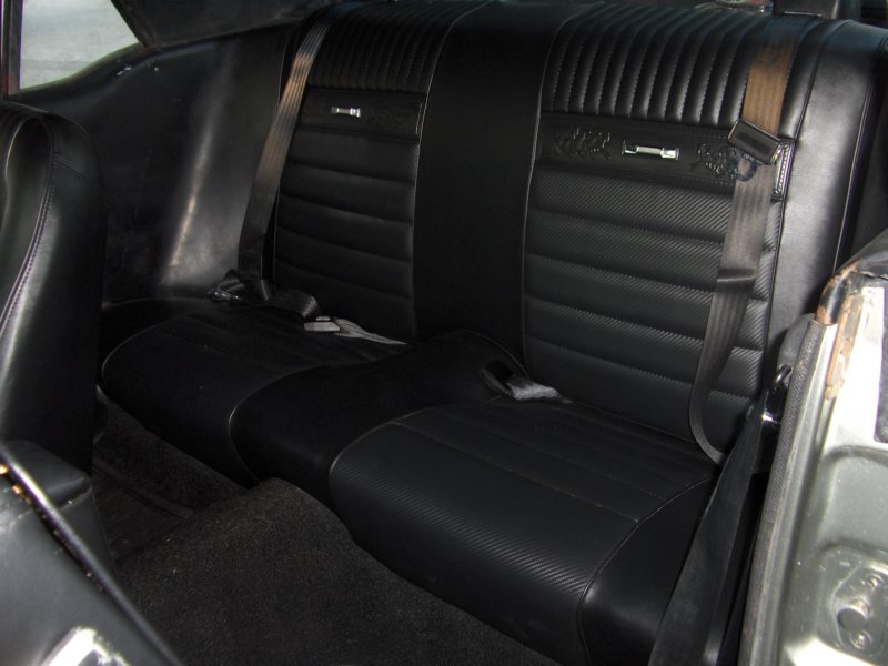 rearseatblackvinylwithcarbonfiberinsertsandponydecorations.jpg