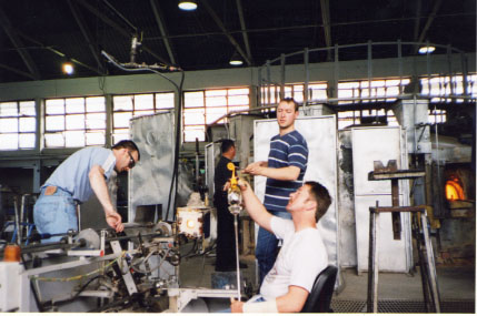 Putting a stem on a blown wine glass, Waterford Crystal Factory