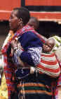 Masai mother carries her baby to market