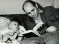     / Leonov reading to his baby