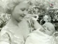     / Vanda holding her newborn son