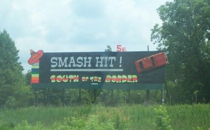 Taken through the window of a speeding car...notice the distance reminder on the top right.