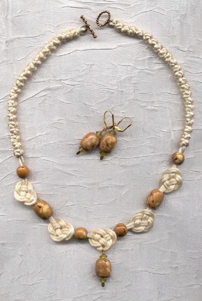 AFFLUENCE chinese knotted necklace with "double coin" knots (prosperity!) and wood beads. $43