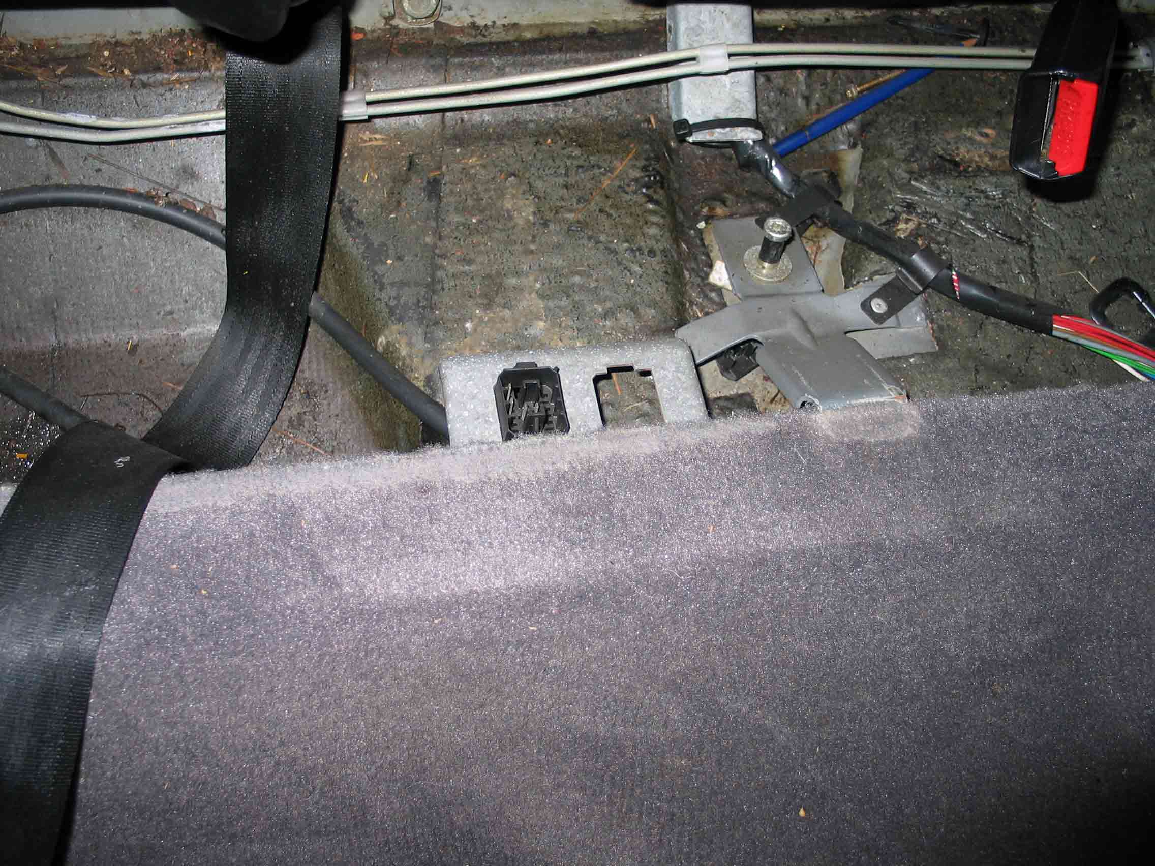 This is the area of the LH 2.4 test plug location on a 1989 3-door 900S.