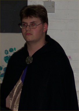 Tony grimaced silently as he realised that someone was again treading on his cloak