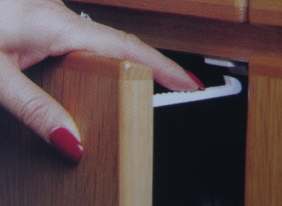 Safety Catches in use.  Just push down with your finger to open the door.  Easy installation