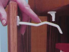 Dual Purpose cabinet and drawer locks, an example in use.  Just push down to open