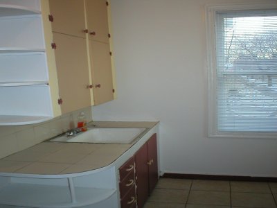 Extra large kitchen with appliances, lots of cabinets, ceramic tile floor and bright-sunny windows 
