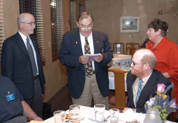 District Governor Bob Heft gives the Oath of Office to the Directors.
