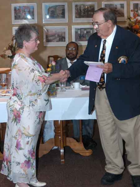 District Governor-Elect Bob Heft installs the 85th president of the Saginaw Downtown Lions Club, Lion Jewel Richardson.