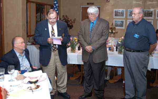 District Governor-Elect Bob Heft (second from left) installs the club's vice presidents.