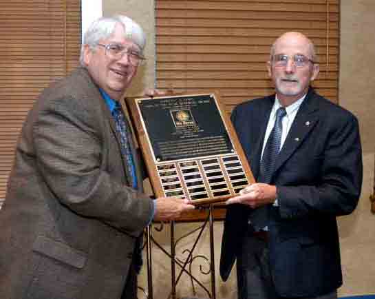 Lion John Senyko (right) receives the Lion of the Year award from last years recipient, Lion Bruce Gale.