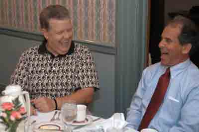 Past Presidents Dr. McCray (left) and Phil Grimaldi share a good laugh.
