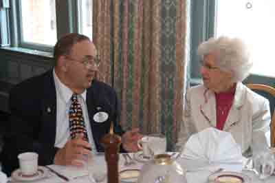 District Governor Bob Heft speaks with Valarie Grimaldi, wife of former member the late Louis Grimaldi.