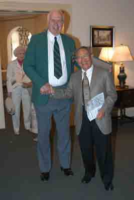 Past presidents Dick Runstrom and Dr. Edgar Balcueva take a moment to demonstrate the differences among humans.
