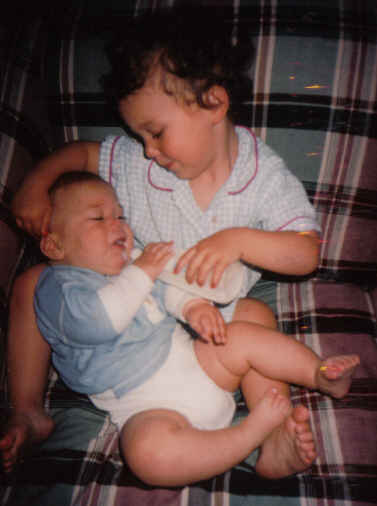 Charlie feeds Jonathan his first bottle 2000