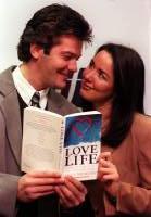Stars from the Channel 4 soap, Brookside, Sam Kane and Claire Sweeney (who play once engaged couple Peter Phelan and Lindsay Corkhill) pick up some tips from a book about love at the launch of the 'National Year of Reading' at the Dillons Bookstore Store in central London January 1998