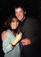 Sam and wife Linda Lusardi at the What's On TV/Carlton party following the British Soap Awards in London. May 1999