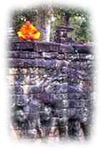 monk on top of stone wall