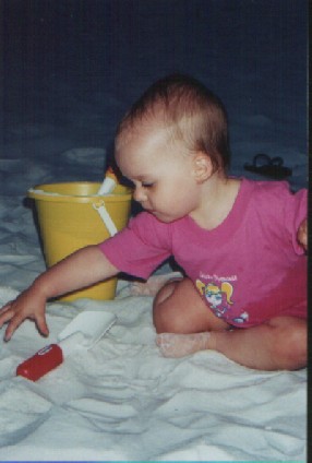 Emma plays in the sand