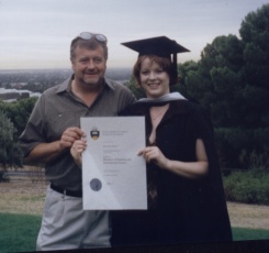 Kylie and her Dad at graduation