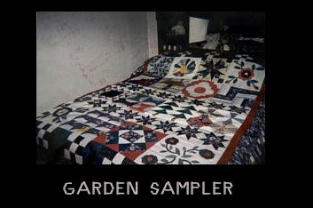 Garden Sampler is a variety of quilt blocks--I love applique so have extra in this quilt. To be able to identify my quilts from others I have added a small appliqued yellow cat to most of my quilts. Can you find it?