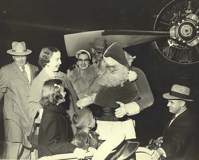 Mayor James C. Gardner with his family visiting Santa on December 21, 1955..