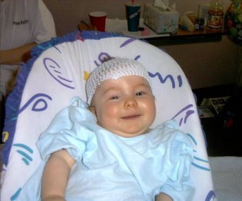 I love having my picture taken.&nbsp;Don't you like my cap?