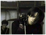 Hyde working the mic and hair in Niji PV