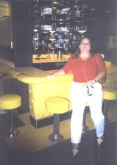 Postmodern Sass's best friend, K, orders a martini at the bar in Graceland.