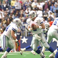 Quarterback Troy Aikman of the Dallas Cowboys prepares to pass