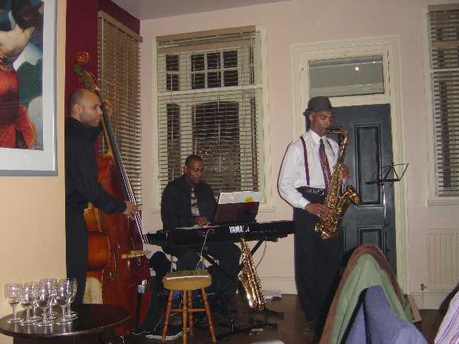 Ralph Lewars on piano, Miles Danso on bass.