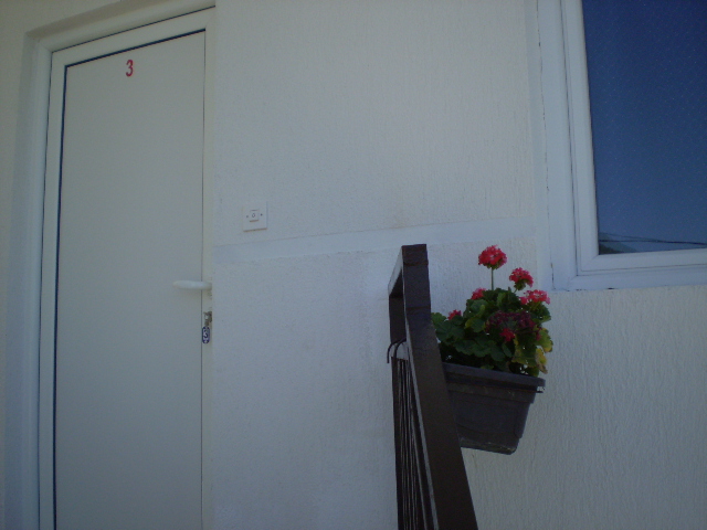 In front of the apartment