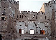 Cracked and decaying, the watchtowers stand like silent sentinels