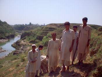 Young locals - a picturesque Qasimi Village in background