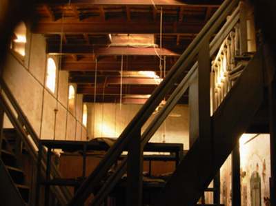 Interior of the Muhafiz Khana. Elegant colonial styled woodwork, balconies, high roofs and sky windows