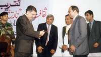 Dr Murad Ali receives prize from Governor NWFP