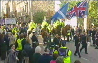 Flag bearers at the front of the parade to the Scottish Parliament as part of the opening ceremony for the new parliament building at Holyrood, Edinburgh, 9th October 2004
