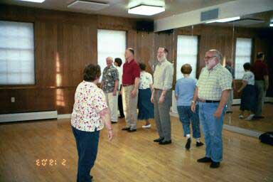 An Instrustor talks the dancers though the dance