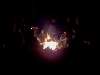 By the glow of the fire
