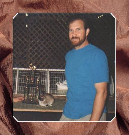 Dale winning Best In Show with a Sable Marten Sr. Buck (Netherland Dwarf Rabbit)