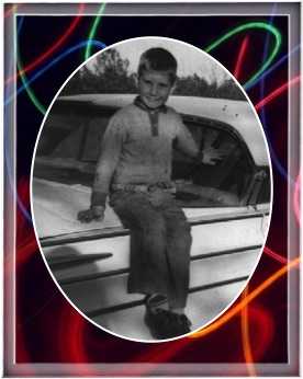 Dale sitting on the back of a car