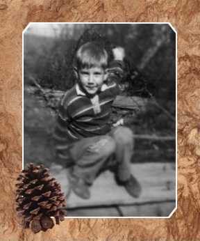 Dale squatting on a log