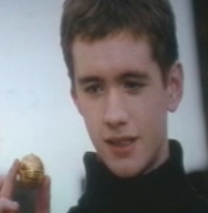 Oliver holding the Golden Snitch.